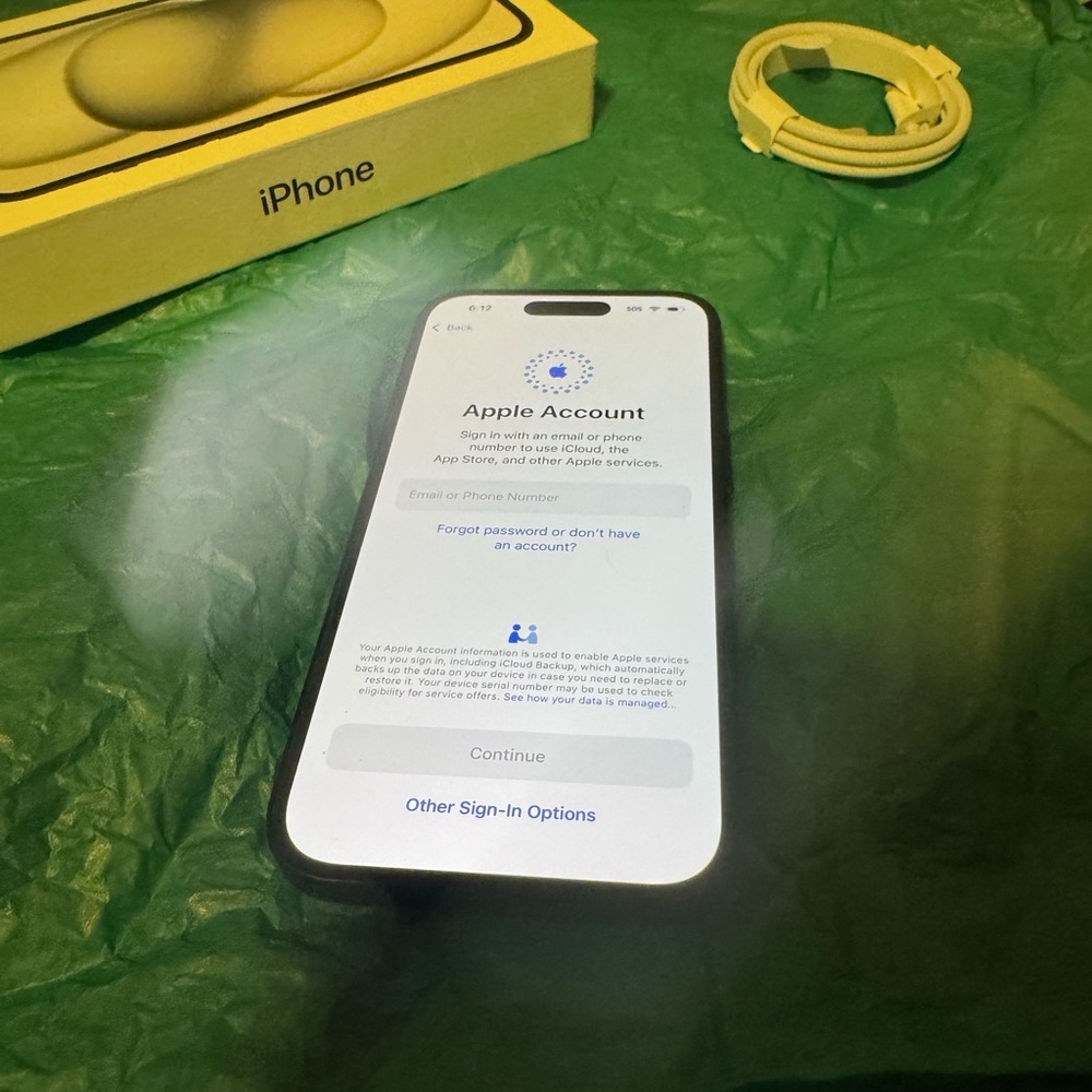Apple Black iPhone with illuminated screen and new packaging